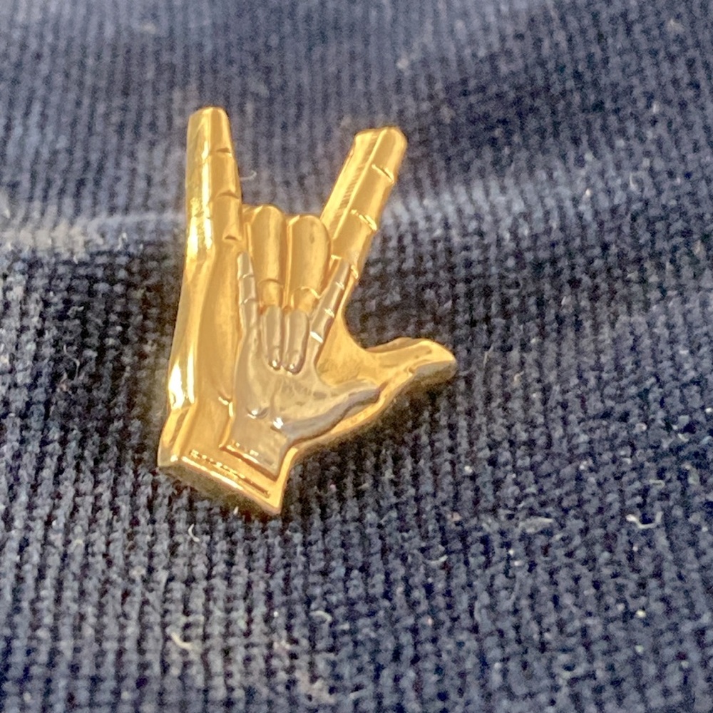 “I love you” in sign language Silver-toned Hand inside a gold-toned hand pin